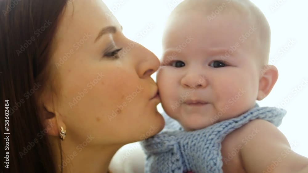 young mother throws baby son at the window young mother throws baby son at the window