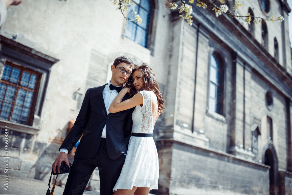 Fototapeta premium happy and loving couple walking and make photo in the old city