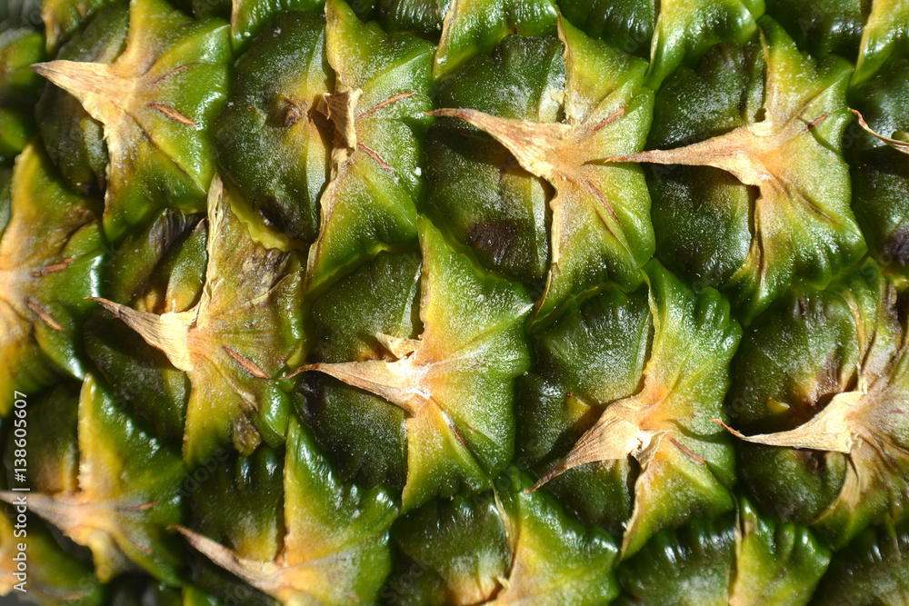 Pineapple fruit close-up. Texture of ananas pattern skin. Pineapple fruit close-up. Texture of ananas pattern skin.