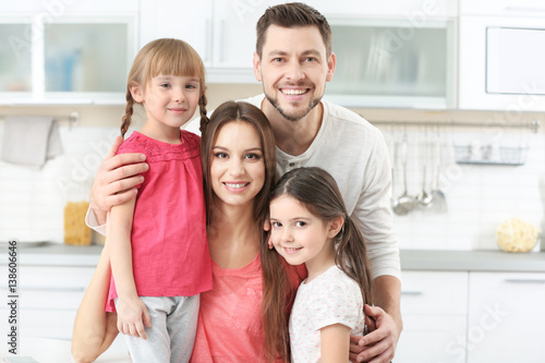 Happy family on kitchen at ...