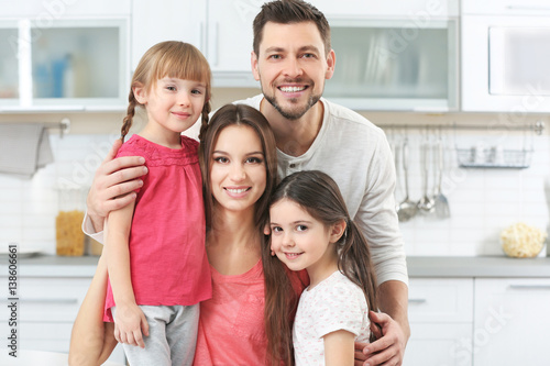 Happy family on kitchen at ...
