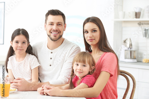 Happy family on kitchen at ...