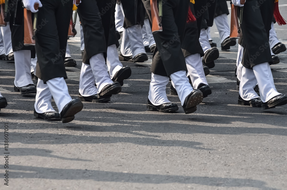 A group of military are walking with assault rifle A group of military are walking with assault rifle