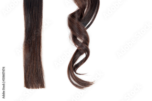 A strand of straight hair and curl on white isolate.