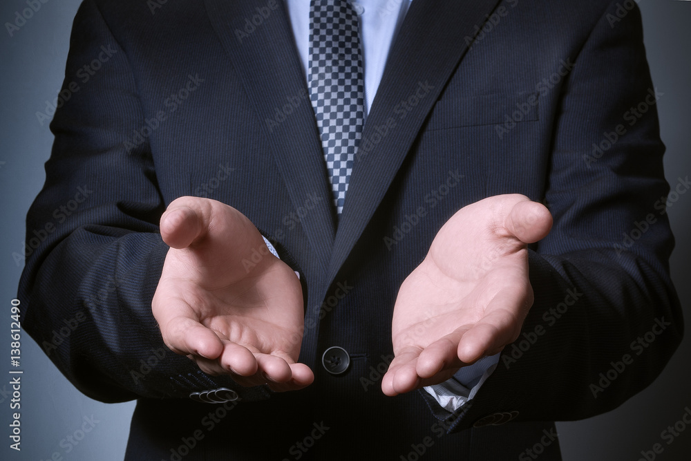 Obraz premium businessman hands closeup. stretching his arms in the hope. Template for hands that give.