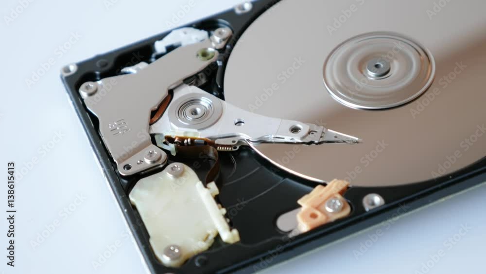 View of disassembled Hard Disk drive spin up and head movement. View of disassembled Hard Disk drive spin up and head movement.