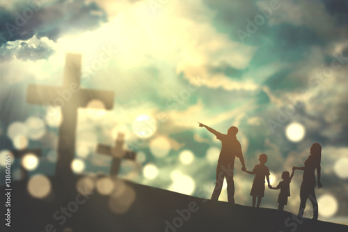 Family walk towards crucifix symbols