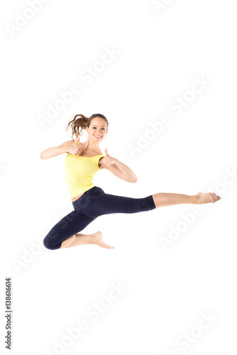 Sport girl jumping isolated on white background.