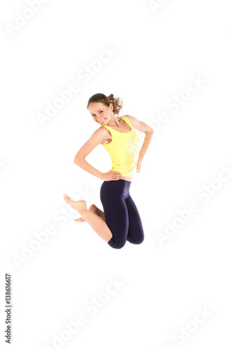 Sport woman jumping isolated on white background. © BestForYou
