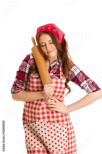 Beautiful young woman holds kitchen roller isolated over white background © Samo Trebizan