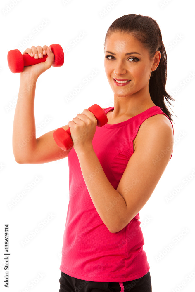 Active young woman workout with dumbbells in fitness gym isolated over white background Active young woman workout with dumbbells in fitness gym isolated over white background