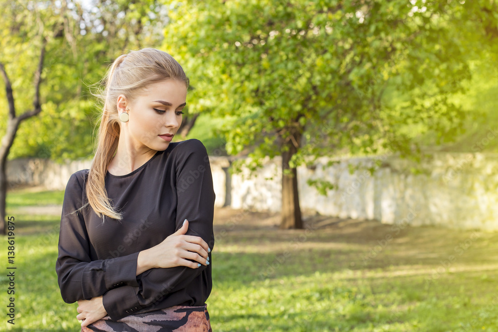Pensive attractive blonde in a spring forest, came out for a walk Pensive attractive blonde in a spring forest, came out for a walk