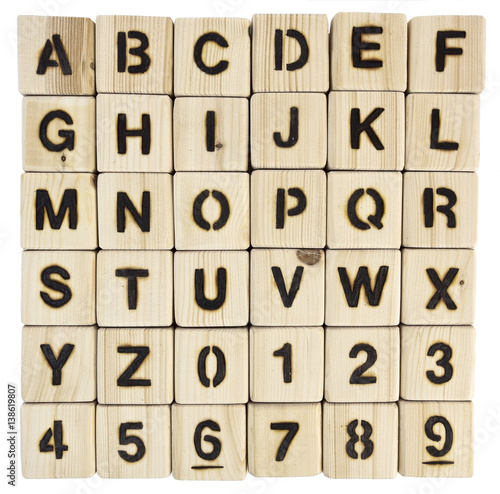 Square grid of wood burned alphabet blocks and numbers zero to nine. iIsolated. photo