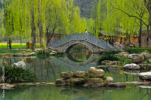 Chinese bridge near the lake during early spring in National Park © yashka7