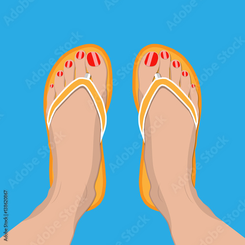 Female feet with red pedicure in summer flip-flops