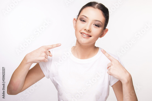 Wallpaper Mural teen girl with brace smiling on white Torontodigital.ca