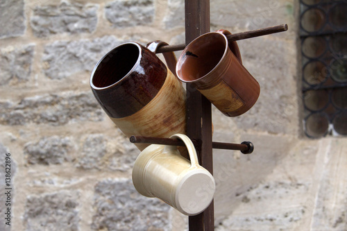 Ceramic mugs / Ceramic ware hanging on the hanger