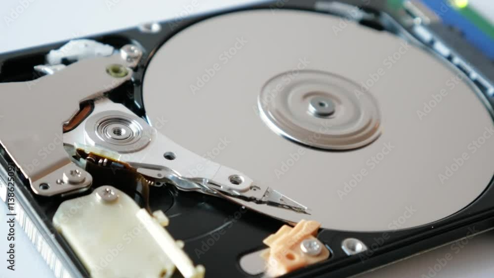 View of disassembled Hard Disk drive spin up and head movement. View of disassembled Hard Disk drive spin up and head movement.