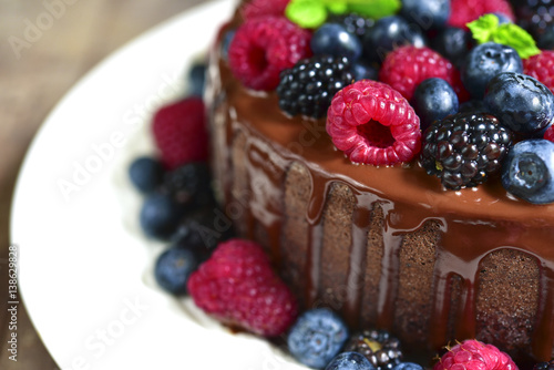 Chocolate cake with fresh forest berries.