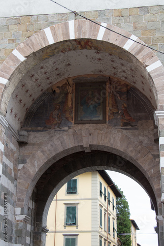 Front fragment of arch in Lucca  Italy.