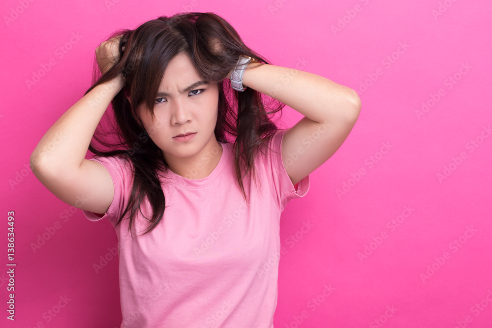 Angry woman screaming out and pulling her hair Angry woman screaming out and pulling her hair