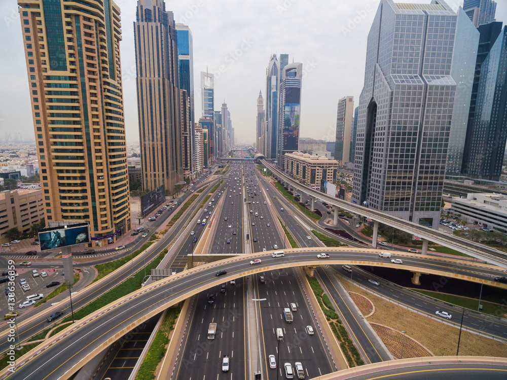 beautiful aerial view of futuristic city landscape with roads, cars, trains, skyscrapers. Dubai, UAE