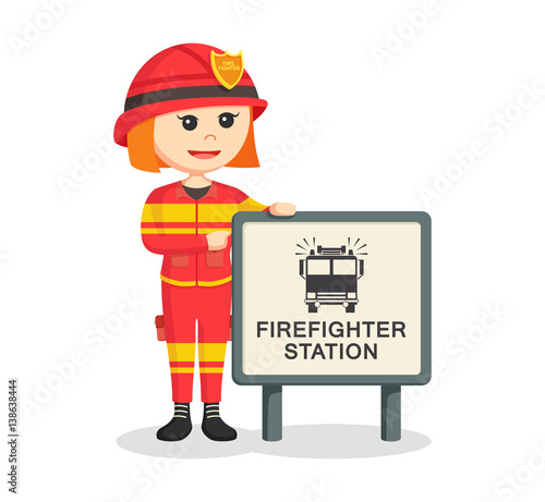fire woman with firefighter station sign © The Last Word