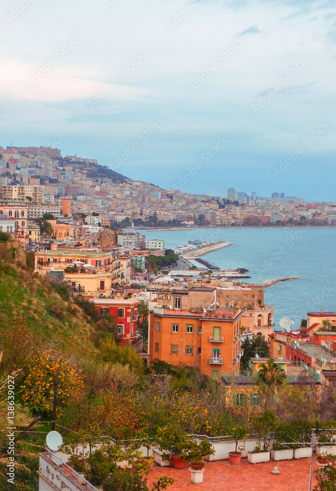 Old Italian town in Autumn. Coastal town with red stone buildings by the sea