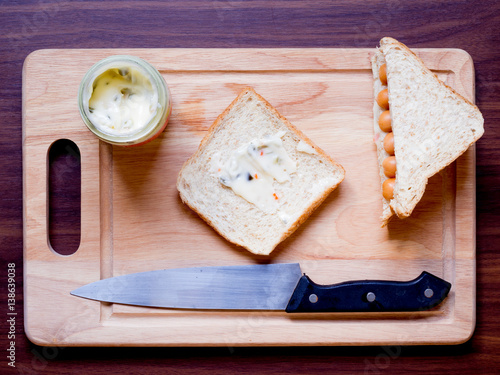 Breakfast with bread and sausage on the cutting board photo