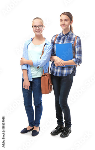 Schoolgirls on white backgr...