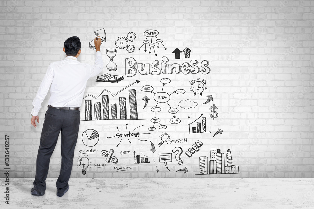 Man in suit pointing Business strategy presentation on white wall background. Man in suit pointing Business strategy presentation on white wall background.