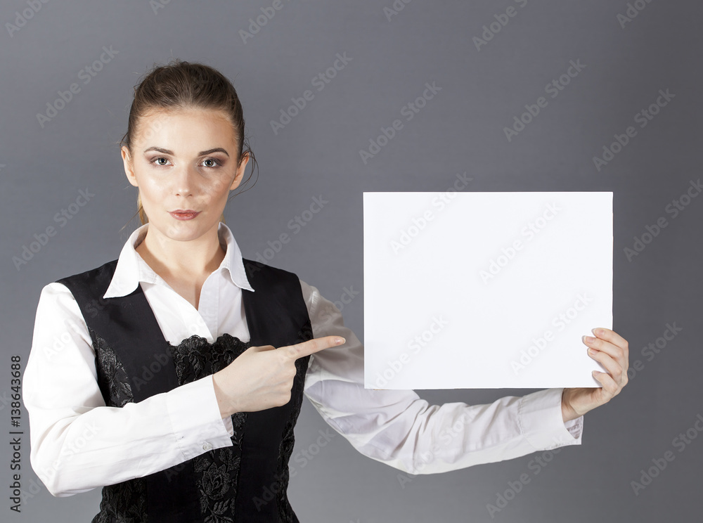 Beautiful sexy woman with white poster on gray background. Show your text
Beautiful sexy woman with white poster on gray background. Show your text