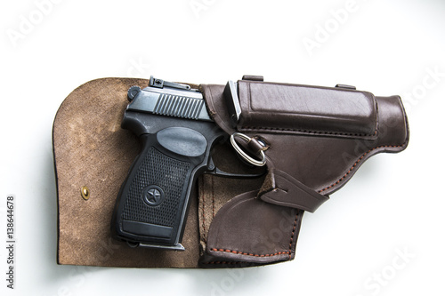 Handgun in a holster on a white background