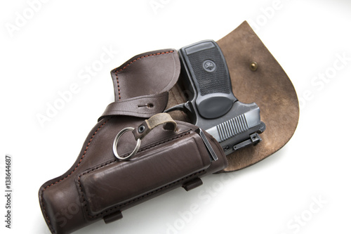 Handgun in a holster on a white background