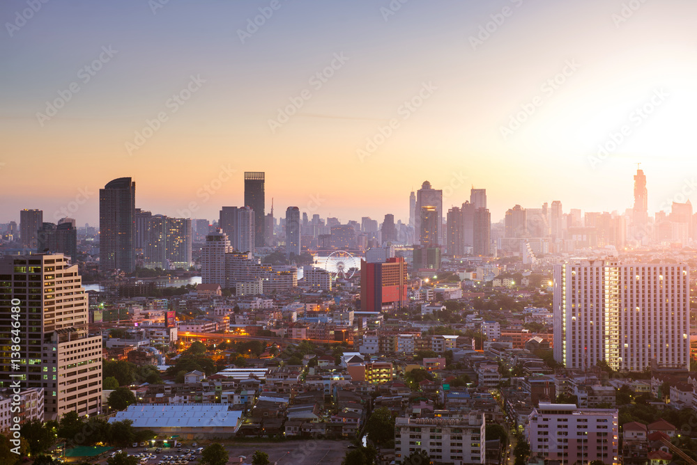 Bangkok skyline sunrise with downtown and business area view.