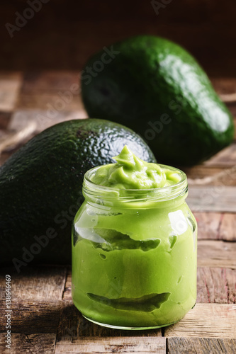 Avocado mousse, old wooden background, selective focus