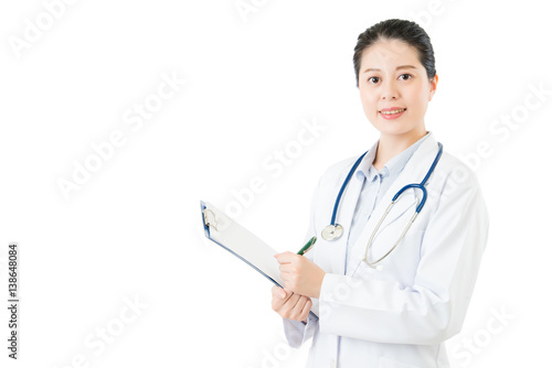 asian doctor holding pen writing medical case on clipboard