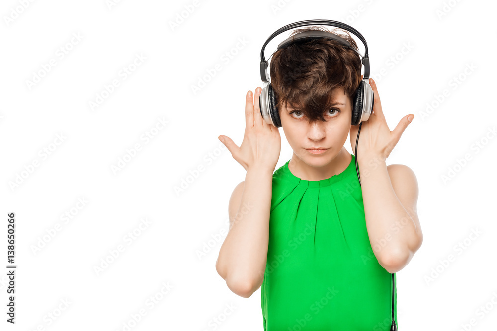 girl with headphones in a green shirt on a white background girl with headphones in a green shirt on a white background