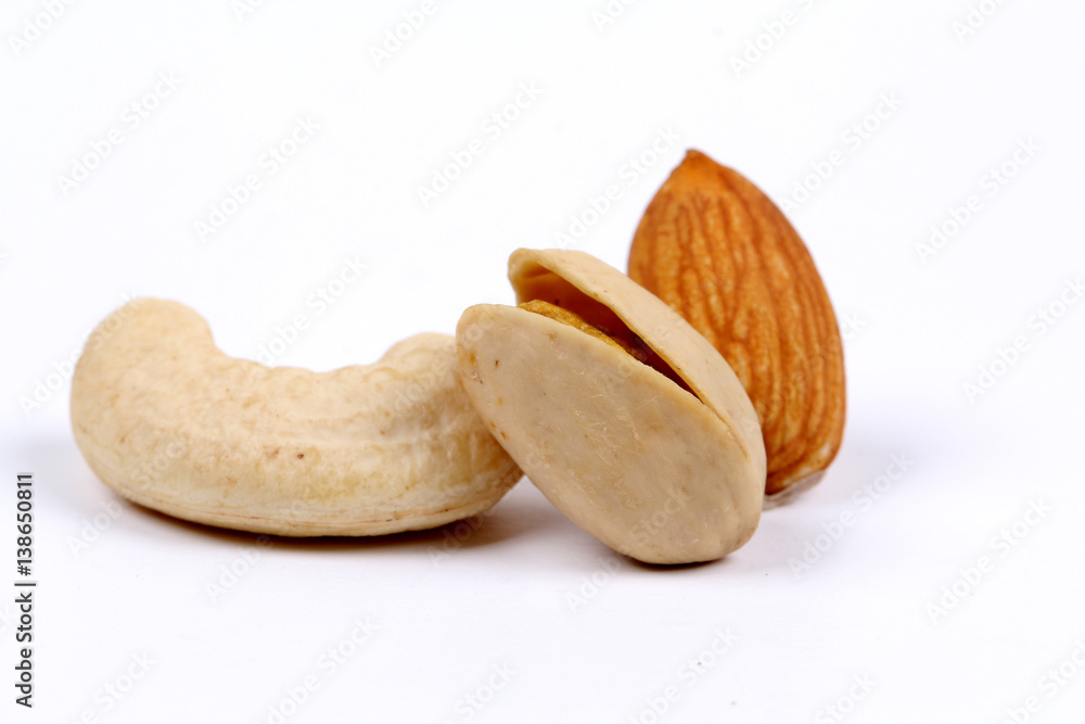 Obraz premium Assorted nuts, dry fruits, mix nuts, almond, walnut, pistachio, cashew, raisin, berry