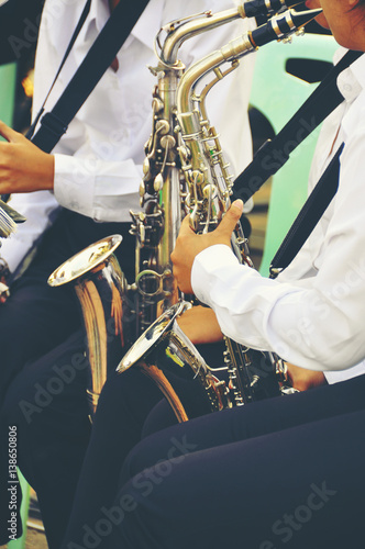 Wallpaper Mural Asian Saxophone Player hands Saxophonist playing jazz music. Alto sax musical instrument closeup Torontodigital.ca