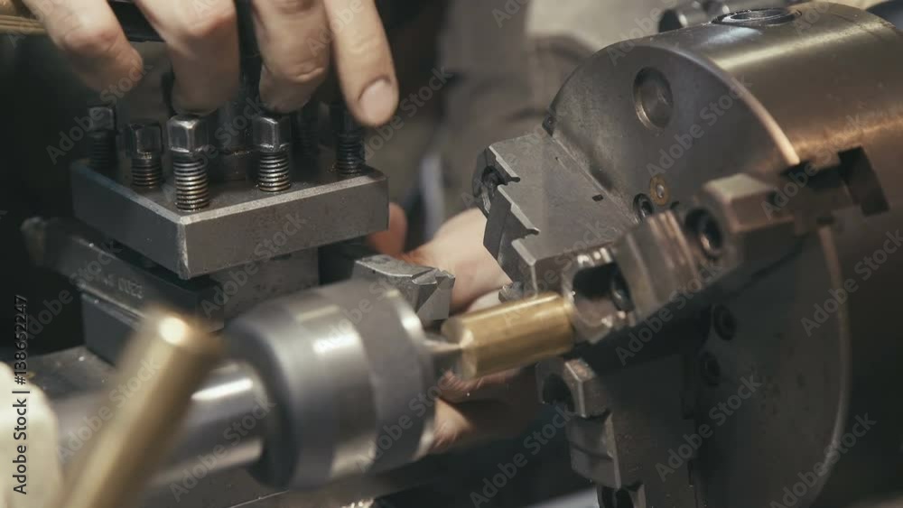 Close-up: the industrial setting of the machine and technical equipment for metal processing. Industrial theme: work plant or enterprise. Lathe or milling. Setting up equipment for metalworking. Close-up: the industrial setting of the machine and technical equipment for metal processing. Industrial theme: work plant or enterprise. Lathe or milling. Setting up equipment for metalworking.