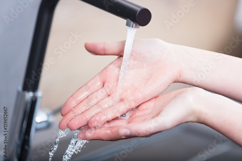 closeup of hands and water flowing