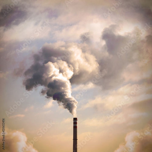 Smoking stack from lignite power plant. Digital artwork on air pollution and climate change theme. Industrial background. 