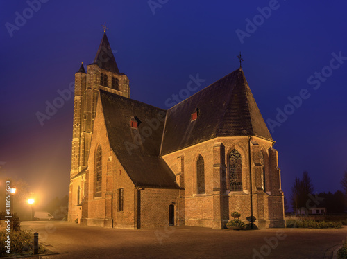 Gothic Saint Michael church at twilight, Ravels, Flanders, Belgium