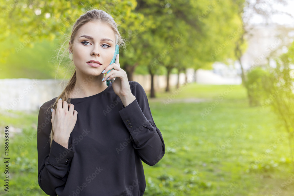 beautiful stylish caucasian woman walk on european city street with phone beautiful stylish caucasian woman walk on european city street with phone