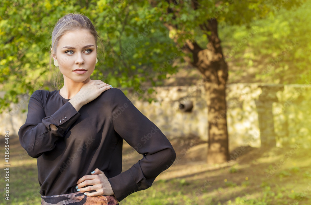 Cheerful smiling young woman on street. Beautiful fresh looking cute blonde girl outdoors at sunset. Street style concept Cheerful smiling young woman on street. Beautiful fresh looking cute blonde girl outdoors at sunset. Street style concept