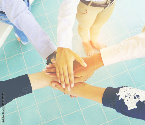 Wallpaper Mural Young business work together. Team work concept. Torontodigital.ca