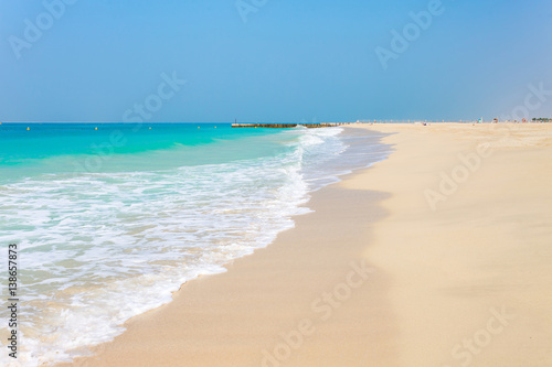 Obraz na płótnie Panoramic view on nice Jumeirah beach in Dubai, UAE. United Arab Emirates famous tourist destination. Clear blue water Persian gulf, Indian Ocean w salonie