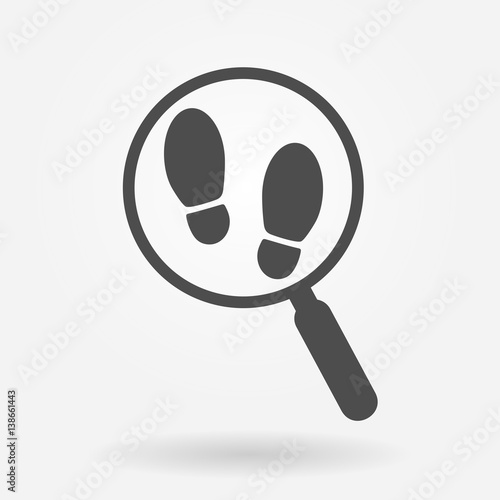 Magnifying glass with footsteps icon
