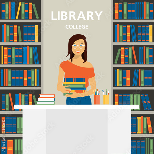 Girl employee of college library. A young woman stands behind a table on the background of bookshelves